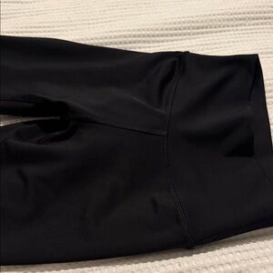 ALO Yoga Black Sweatpants has a little hole